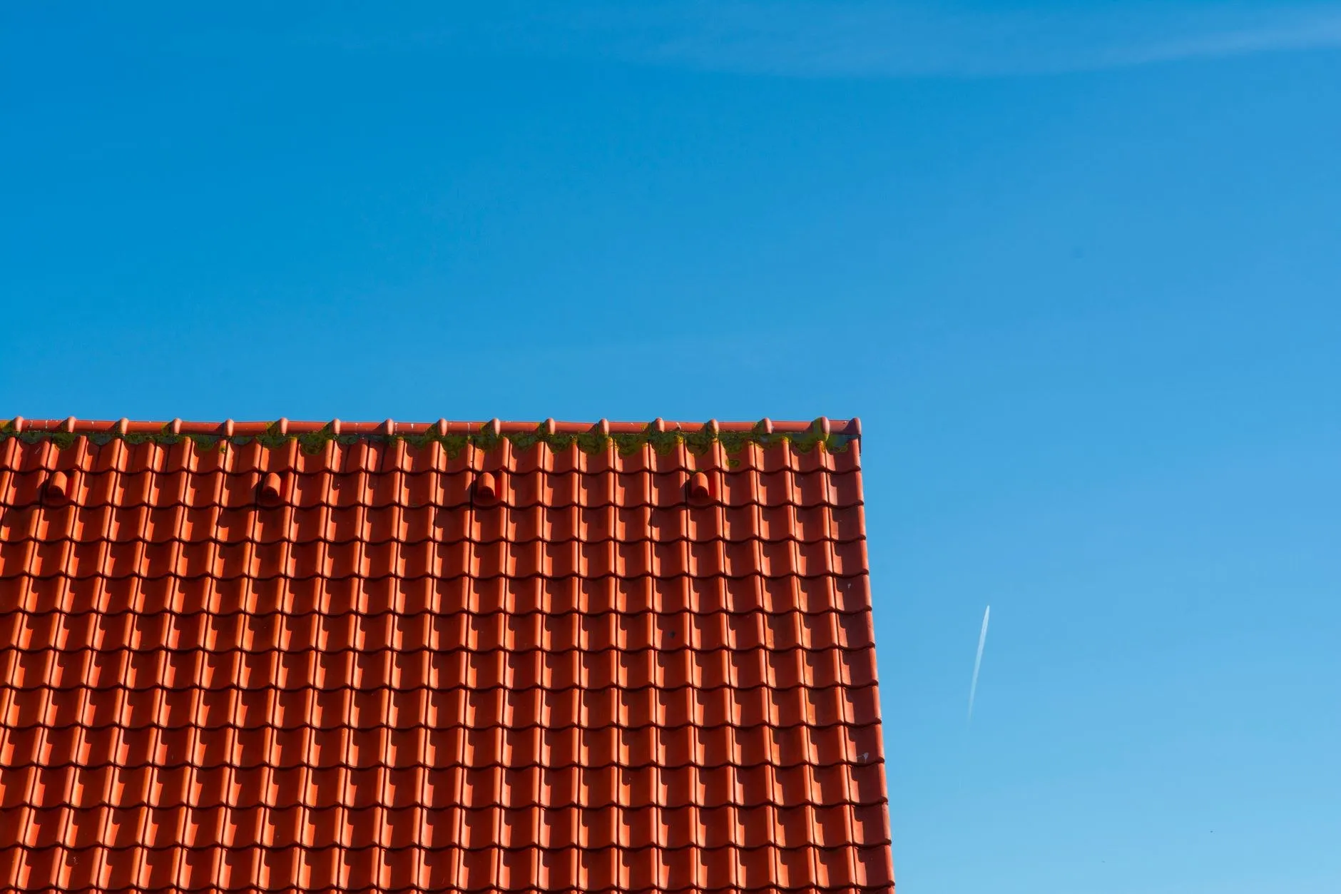 A weather-worn roof before re-roofing